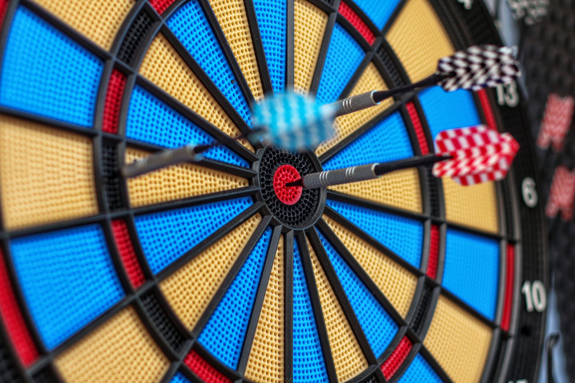 Darts gathered around the bullseye
